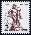 Sellos de Asia - Corea del norte -  Scott  3507  Niño y niña con pelota de futbol