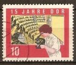 Stamps Germany -  15 Años de DDR-Estudiante con microscopio y salon de conferencias.