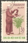 Stamps Vietnam -  Regando un árbol