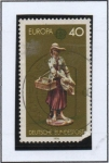 Stamps Germany -  Muchacha que vende baratijas